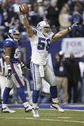 Dallas Cowboys linebacker Dat Nguyen (59) returns the ball 19