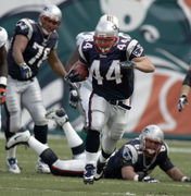 Miami Dolphins vs. New England Patriots. Fans support on NFL Game.  Silhouette of supporters, big screen with two rivals in background Stock  Photo - Alamy