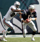 Miami Dolphins vs. New England Patriots. Fans support on NFL Game.  Silhouette of supporters, big screen with two rivals in background Stock  Photo - Alamy