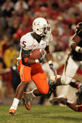 Miami tight end Greg Olsen (82) is brought down by Maryland's Marcus  Wimbush (12) he carries the ball as he during the second quarter of the  Hurricanes game against the Terrapins at