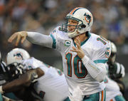 Miami Dolphins Chad Pennington (10) talks in the huddle in the first  quarter against the New