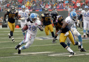 27 September 2009: Tennessee Titans #28 Chris Johnson gets tackled. The New  York Jets defeated the Tennessee Titans 24-17 at Giants Stadium in  Rutherford, New Jersey. In honor of AFL Legacy weekend