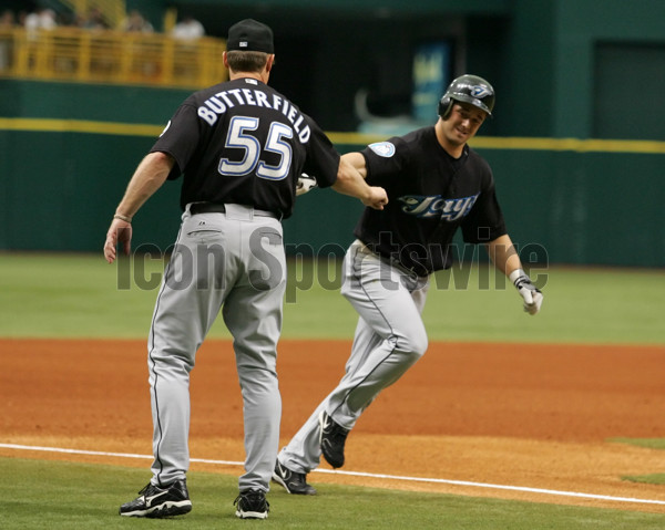 Tampa Bay Devil Rays' Aubrey Huff, left is congratulated by