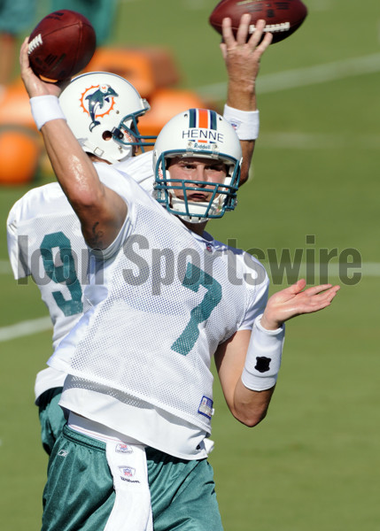 Miami Dolphins - Quarterback Chad Henne (7) hands off to running