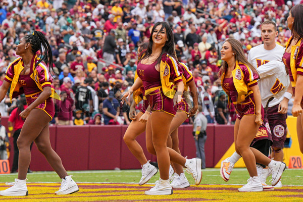 LANDOVER, MD - SEPTEMBER 25: Washington Commanders cheerleaders perform  during the game between the