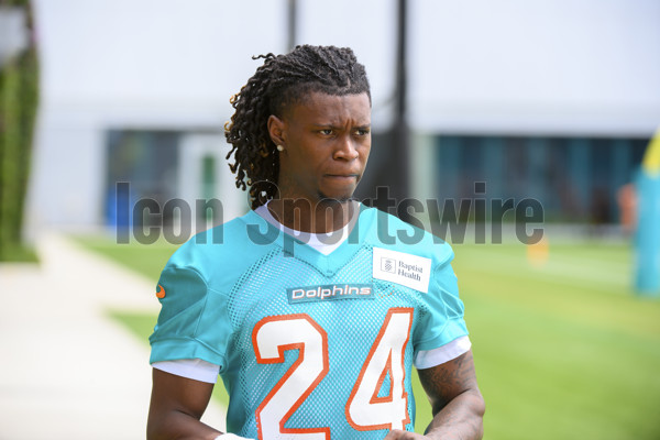 Miami Dolphins cornerback Cam Smith stretches during practice at