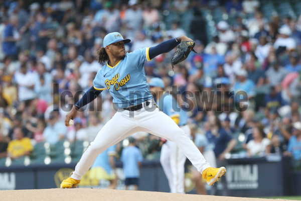 Milwaukee Brewers' Freddy Peralta poses for a picture with a