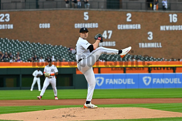 DETROIT, MI - AUGUST 29: Detroit Tigers first baseman Spencer Torkelson  (20) and Detroit Tigers relief pitcher Will Vest (19) look at their tablet  during the Detroit Tigers versus the New York