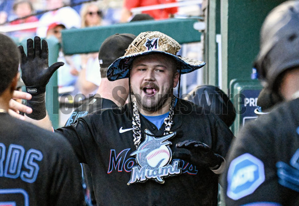 Miami Marlins' Jake Burger celebrates his home run during the